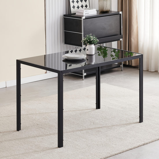 Contemporary Rectangular Dining Table for Four Featuring a Tempered Glass Surface And Steel Legs Offered in Two Color Options